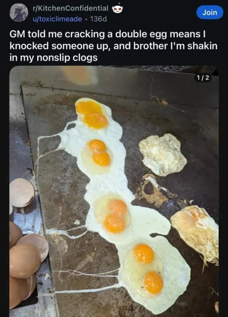 Griddle full of double yolk eggs in a restaurant kitchen with a worried line cook caption