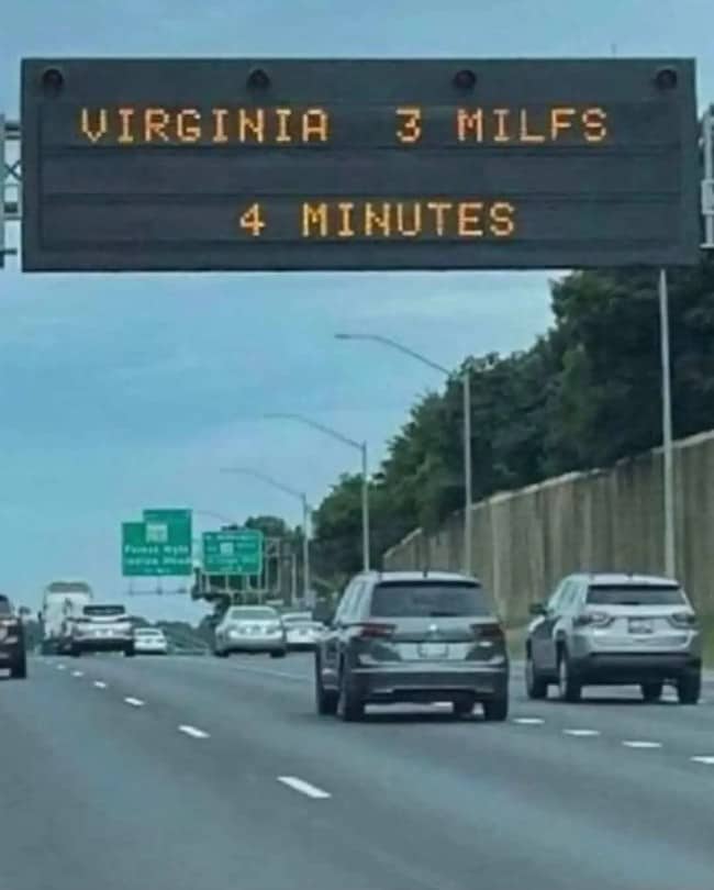 Highway message sign with an unfortunate typo in the distance to Virginia, above traffic.
