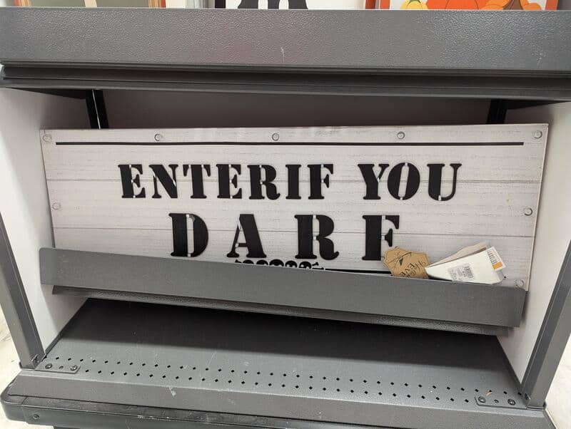 Halloween store sign with bad spacing that reads ENTERIF YOU DARE