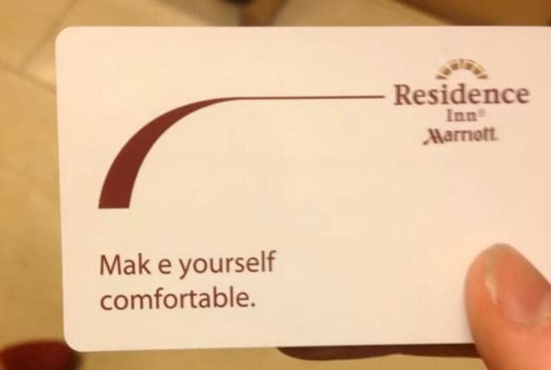 Hotel key card with bad kerning that reads Mak e yourself comfortable