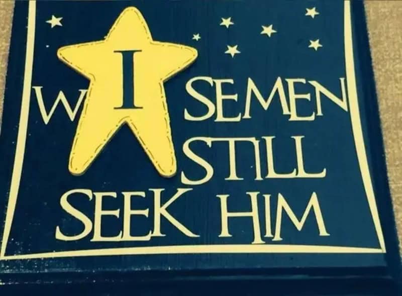 Navy wooden holiday sign where a star placement makes Wise men still seek him read badly