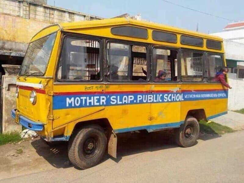 Yellow school bus with spacing that makes it read Mother Slap Public School