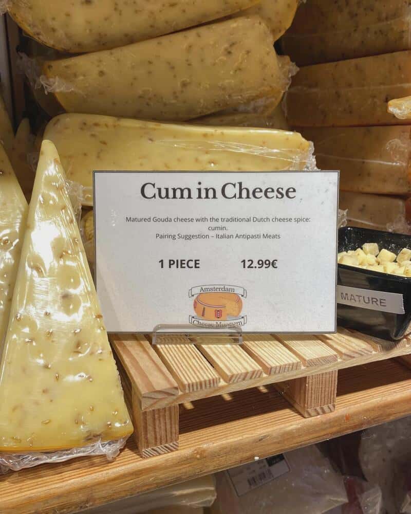 Cheese shop sign for cumin gouda with spacing that turns the name into innuendo
