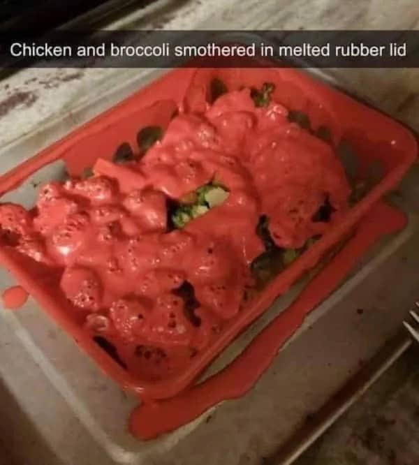Chicken and broccoli dish covered in a melted red silicone lid straight from the oven