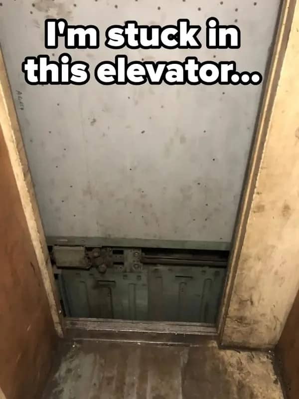 Elevator car stuck out of line with the floor, exposing machinery beneath the door