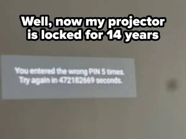 Blurry projector screen warning that a wrong PIN locked it for 472 million seconds
