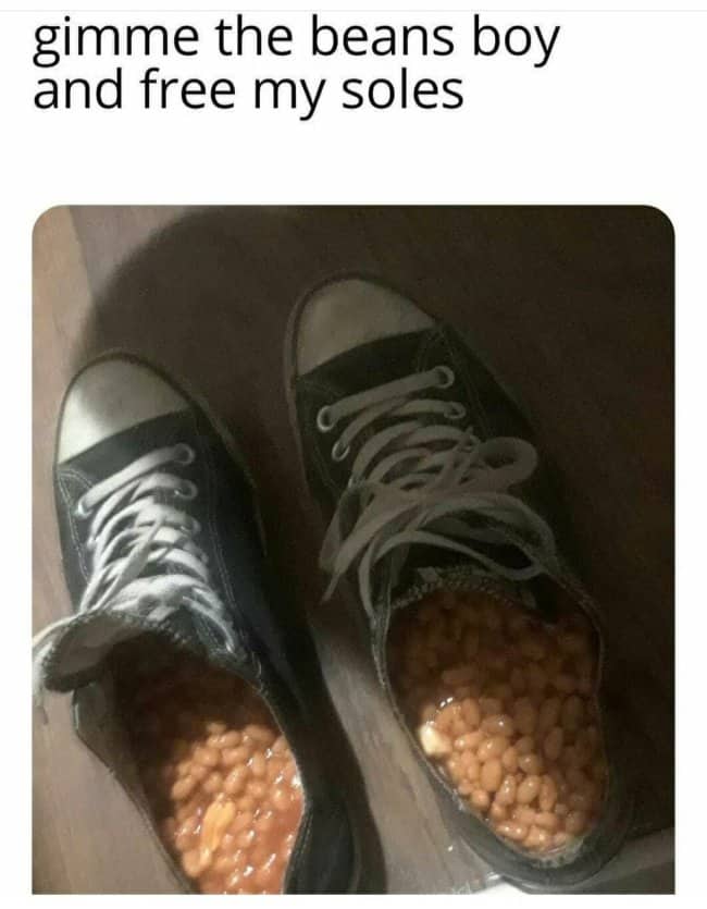 Pair of black Converse sneakers filled to the top with baked beans, captioned free my soles.