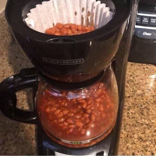 Black and Decker coffee maker with baked beans in the filter and a carafe full of beans.