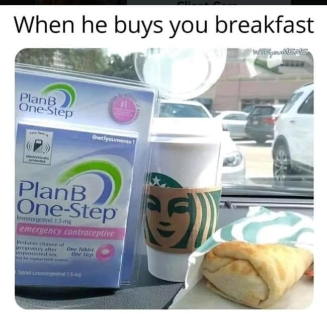 Car dashboard with a coffee cup, wrapped breakfast sandwich, and an emergency contraceptive box.