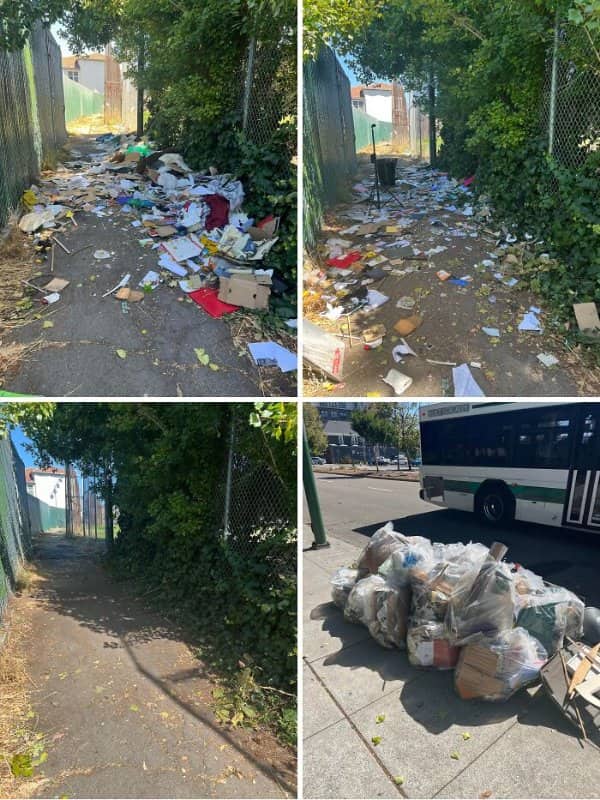 Litter-filled alley path gradually cleared, with collected garbage bags piled near a passing bus.
