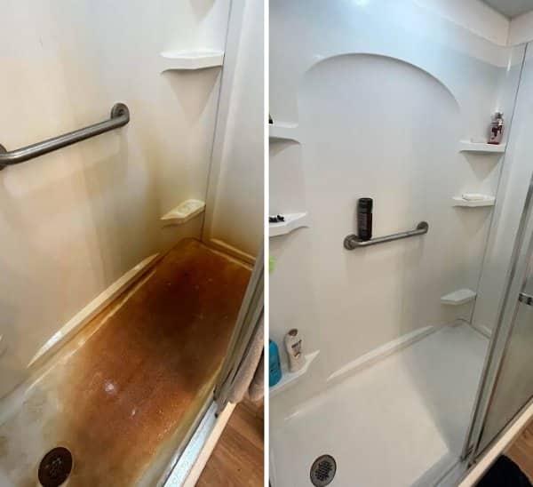 Shower stall with heavy orange rust stains on the floor scrubbed back to bright white.