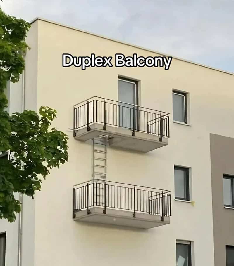 Two stacked apartment balconies connected only by a metal ladder, a strange construction fails design.