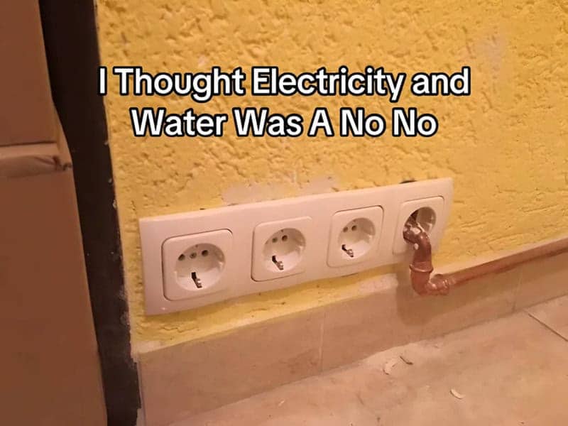 Copper water pipe running directly into the fourth socket of a wall outlet strip.