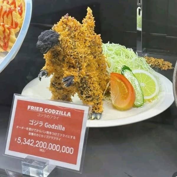 Restaurant display of a fried Godzilla figure on a plate with an absurd yen price.