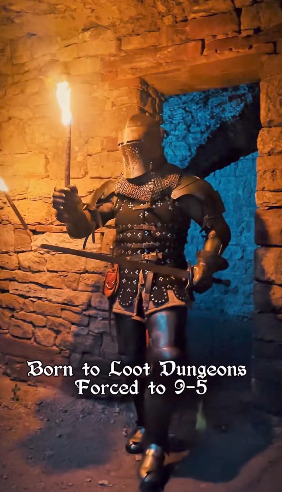 Armored knight holding a torch in a dungeon, captioned born to loot dungeons, forced to 9-5.