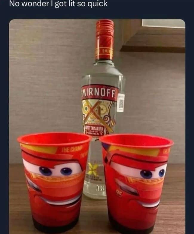 Bottle of Smirnoff vodka beside two Lightning McQueen kids cups, with a joke about getting lit fast.