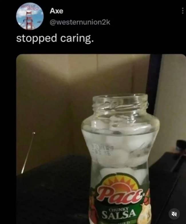 Empty chunky salsa jar repurposed as a drinking glass full of ice, captioned stopped caring.