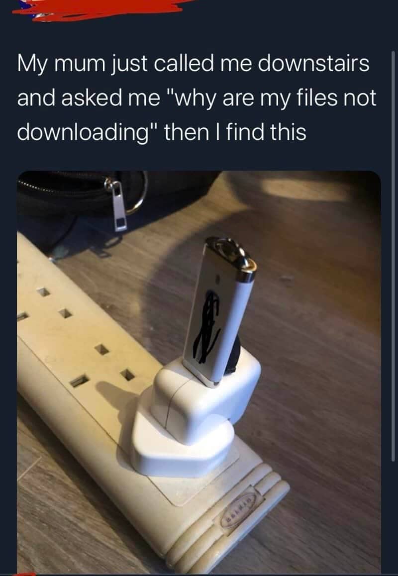 USB flash drive plugged into a wall phone charger on a power strip instead of a computer.