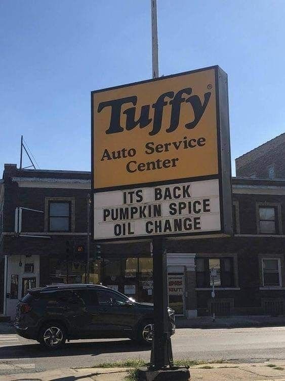 Tuffy auto service sign advertising the return of a pumpkin spice oil change.
