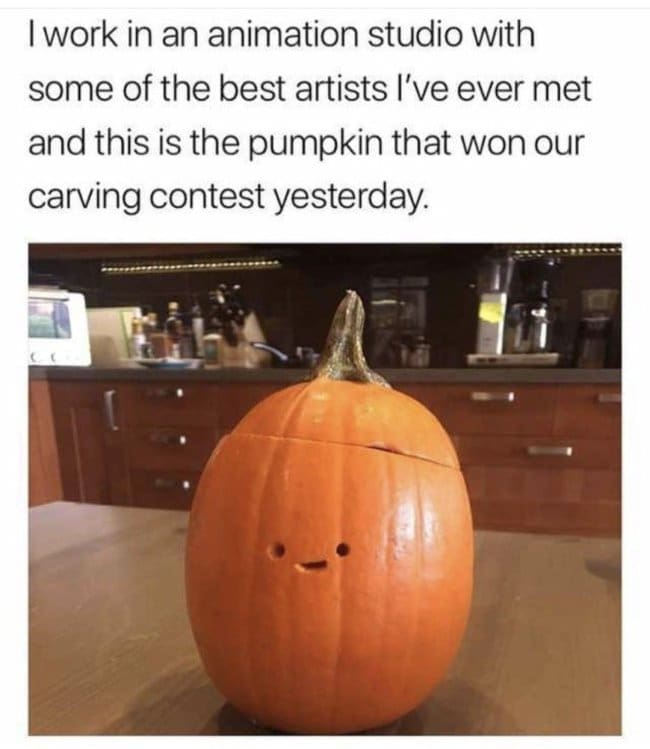 Simple pumpkin with two dots and a tiny smile that won a carving contest.