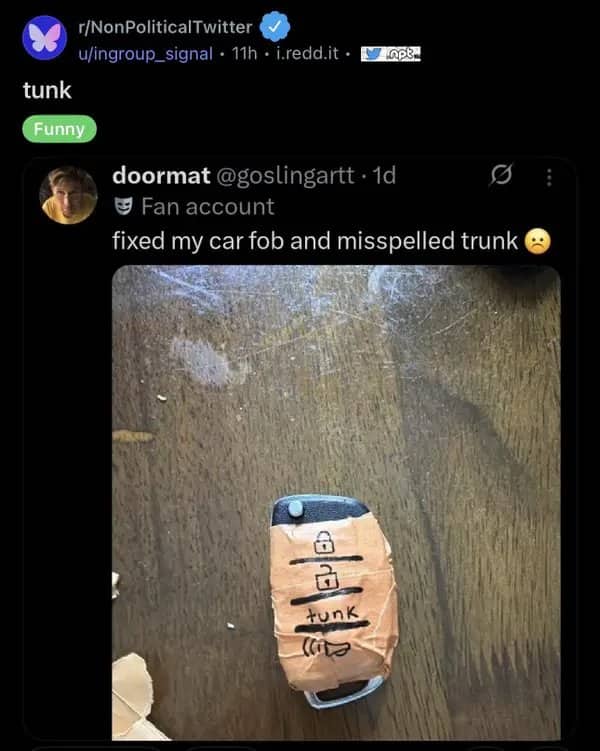 Car key fob repaired with tape and hand-labeled buttons, with trunk misspelled as tunk.