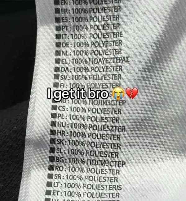 Clothing tag listing one hundred percent polyester in dozens of languages, captioned I get it bro.