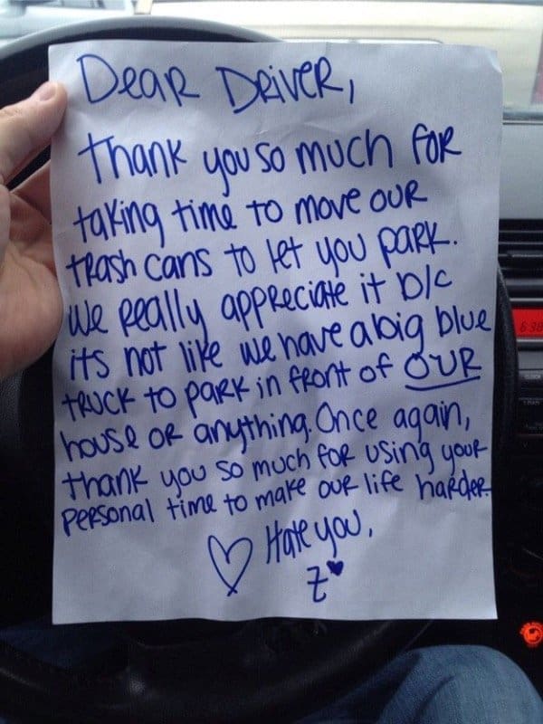 Sarcastic note thanking a driver for moving trash cans to park outside someone's house.