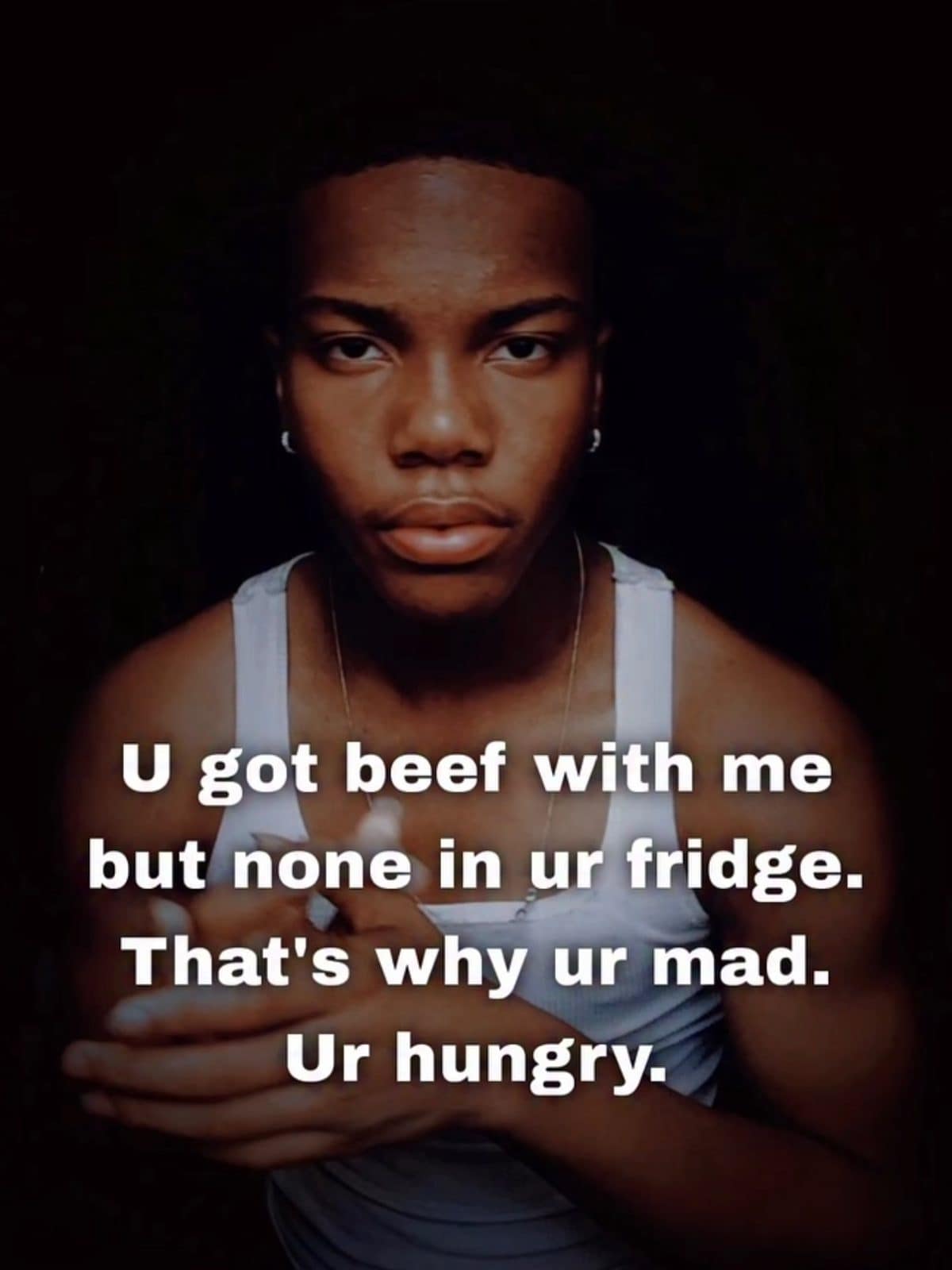 Man in a white tank top with text saying you're not mad, you're hungry