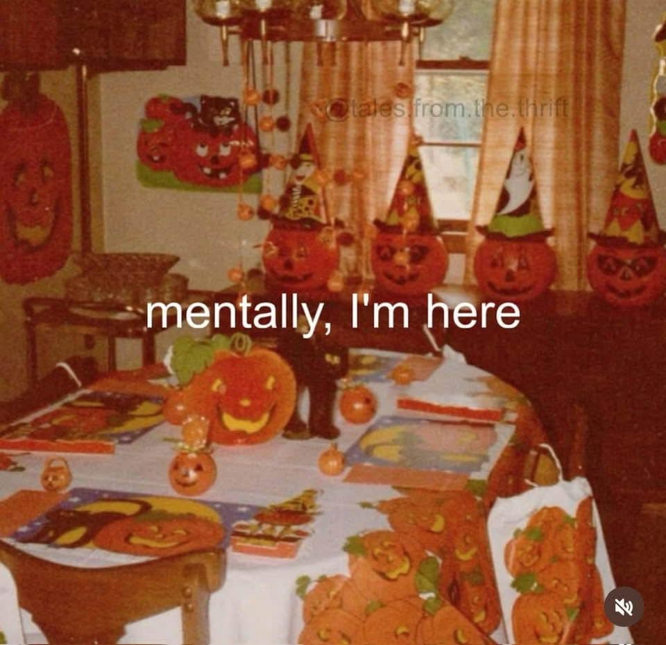 Vintage Halloween party room covered in pumpkins, captioned mentally I'm here, in a meme dump.