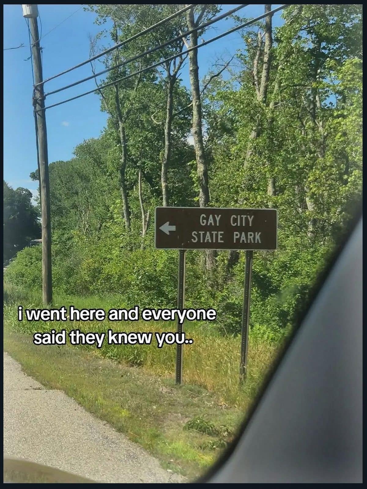 Road sign pointing to Gay City State Park with a teasing caption about a friend.