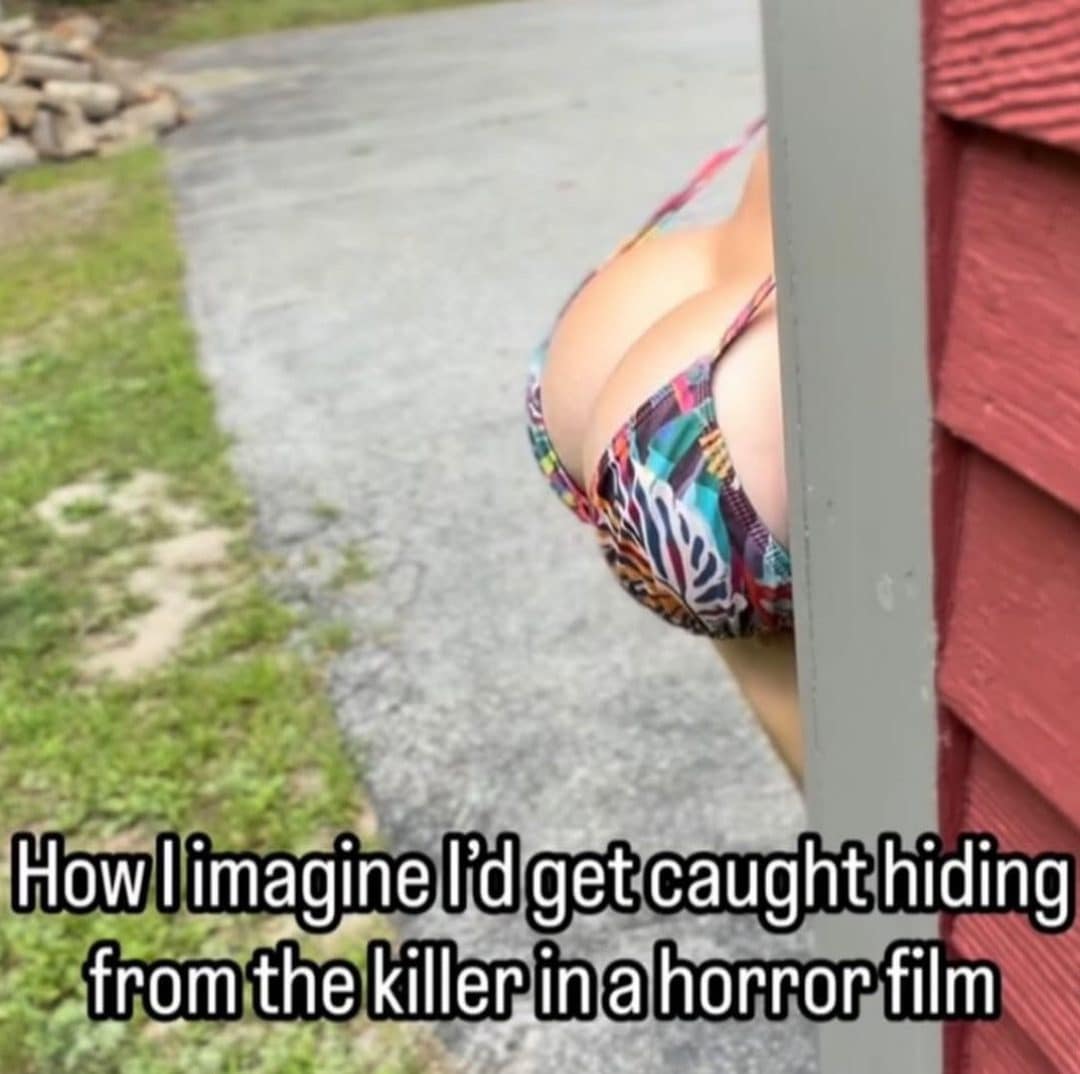 Person in a bikini badly hidden behind a barn post with a horror movie caption