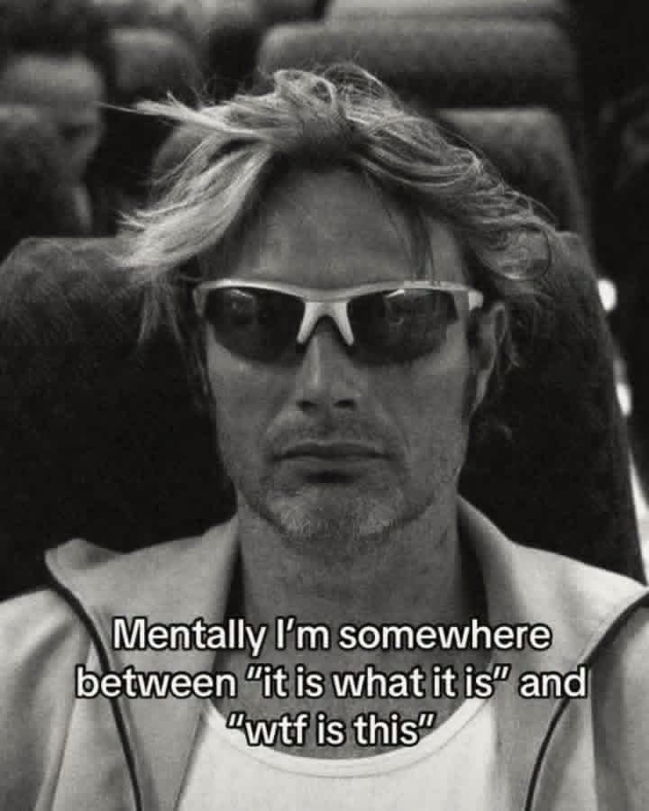 Black and white man in sunglasses torn between it is what it is and confusion