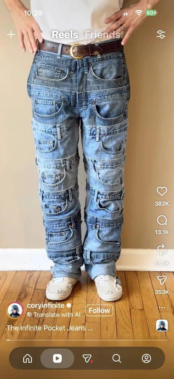 Pair of jeans with dozens of back pockets stitched down both legs from hip to ankle