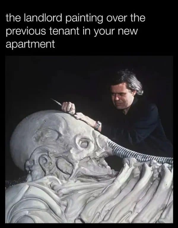 Artist sculpting a huge alien head, joked as a landlord painting over the last tenant