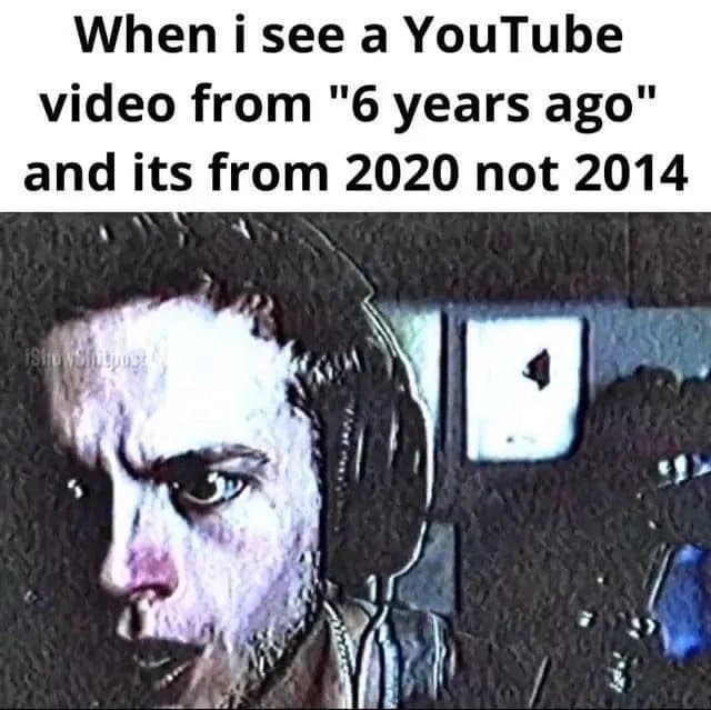 Shocked man realizing a YouTube video from six years ago is from 2020, not 2014