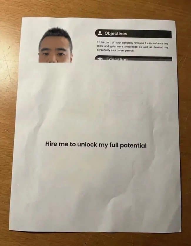 Nearly blank resume with a half-cropped photo reading hire me to unlock my full potential.