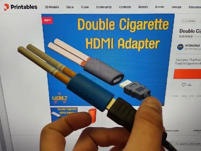 3D printed gadget that looks like two cigarettes plugged into an HDMI adapter.