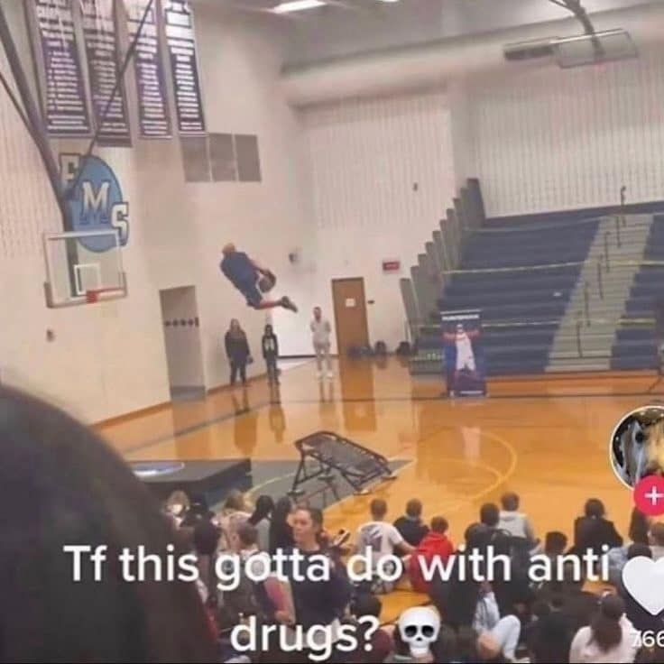 Meme dump photo of an anti drug assembly where an acrobat dunks off a trampoline