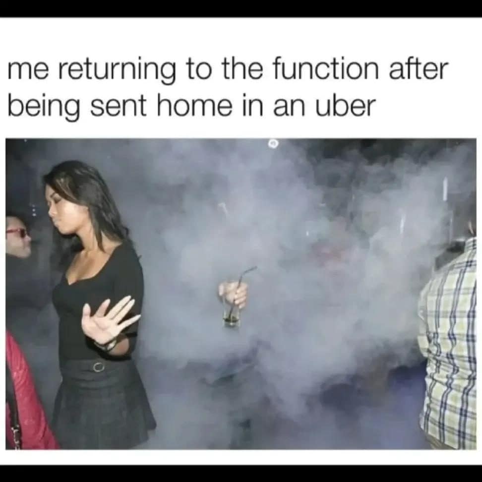 Woman strolling back into a smoky party with a drink after being sent home