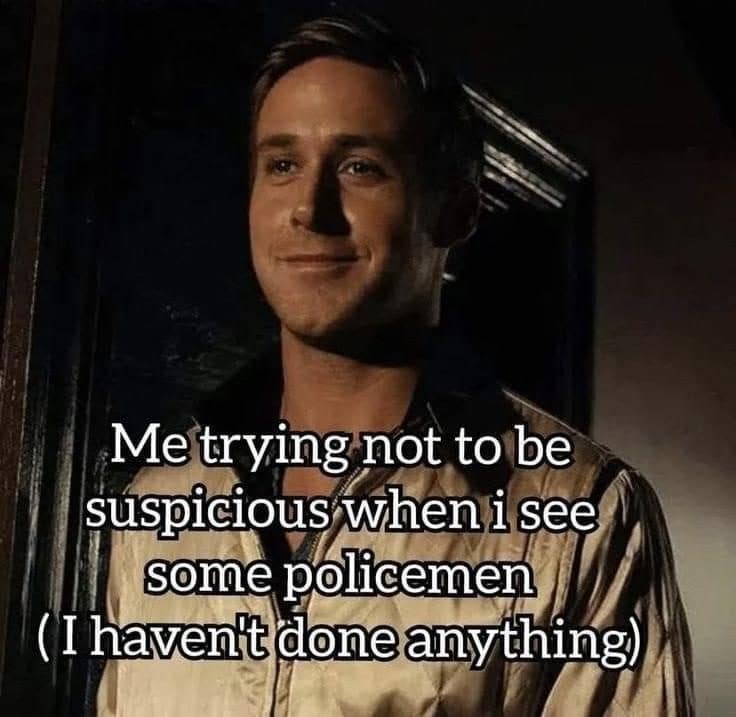 Ryan Gosling grinning nervously, about acting suspicious around police after doing nothing wrong