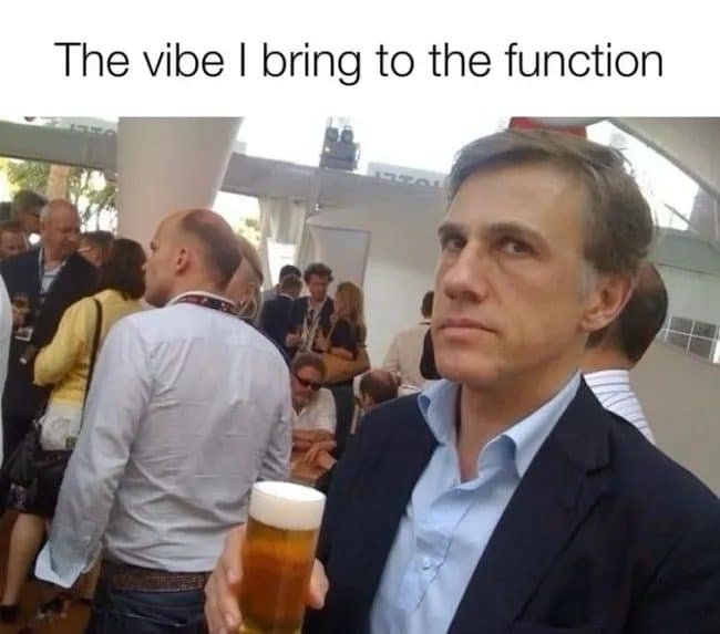 Man in a blazer holding a beer and staring blankly, a meme dump party vibe.