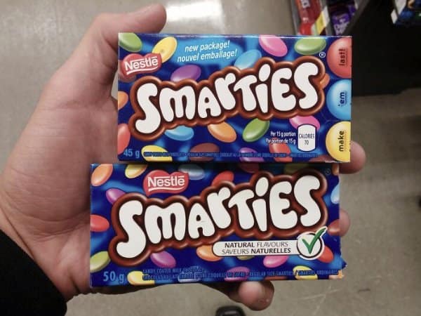 Smarties boxes in shrinkflation examples with a new package holding 45 grams instead of 50.