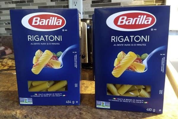 Two Barilla rigatoni boxes that look identical, one 454 grams and the newer one 410.