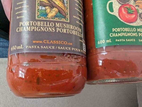 Two Classico portobello pasta sauce jars, one 650 mL and the newer one 600 mL.
