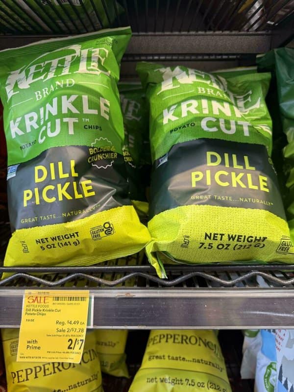Kettle dill pickle chip bags that look identical, among shrinkflation examples, holding 5 and 7.5 ounces.