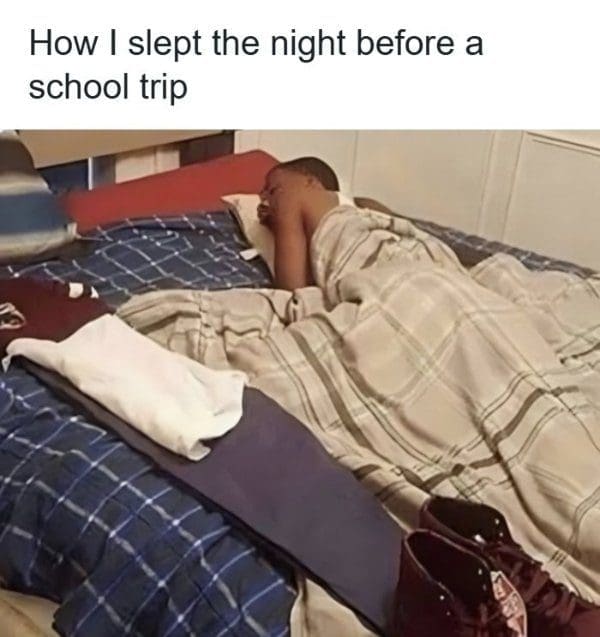 Kid asleep in bed fully dressed with shoes ready, the night before a school trip.