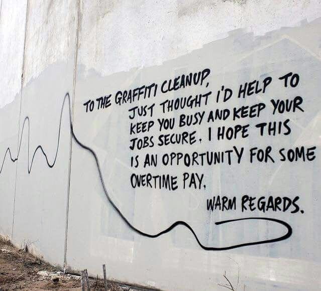 Long graffiti message thanking the cleanup crew and hoping it earns them overtime pay.