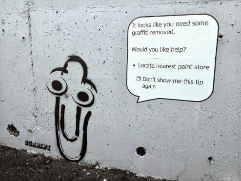 Graffiti of the old paperclip assistant offering help locating the nearest paint store.