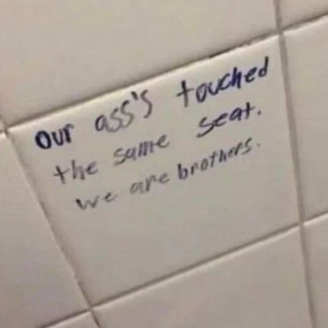 Thoughtful graffiti on a bathroom tile declaring everyone who used the seat is family.