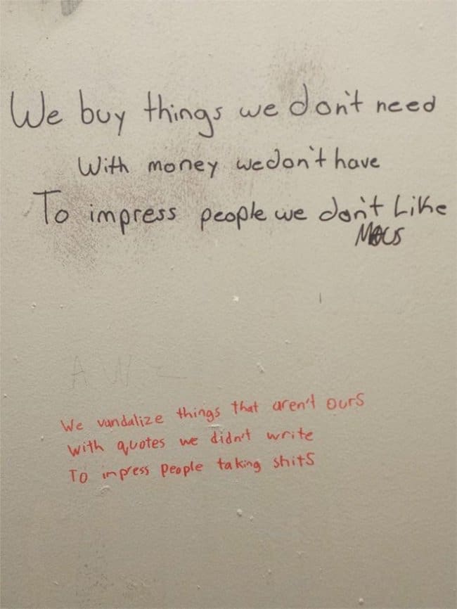 Bathroom wall quote about buying things we don't need, answered by a sarcastic red reply.